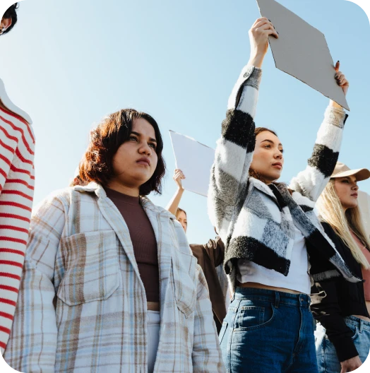 Group demonstrating with raised signs