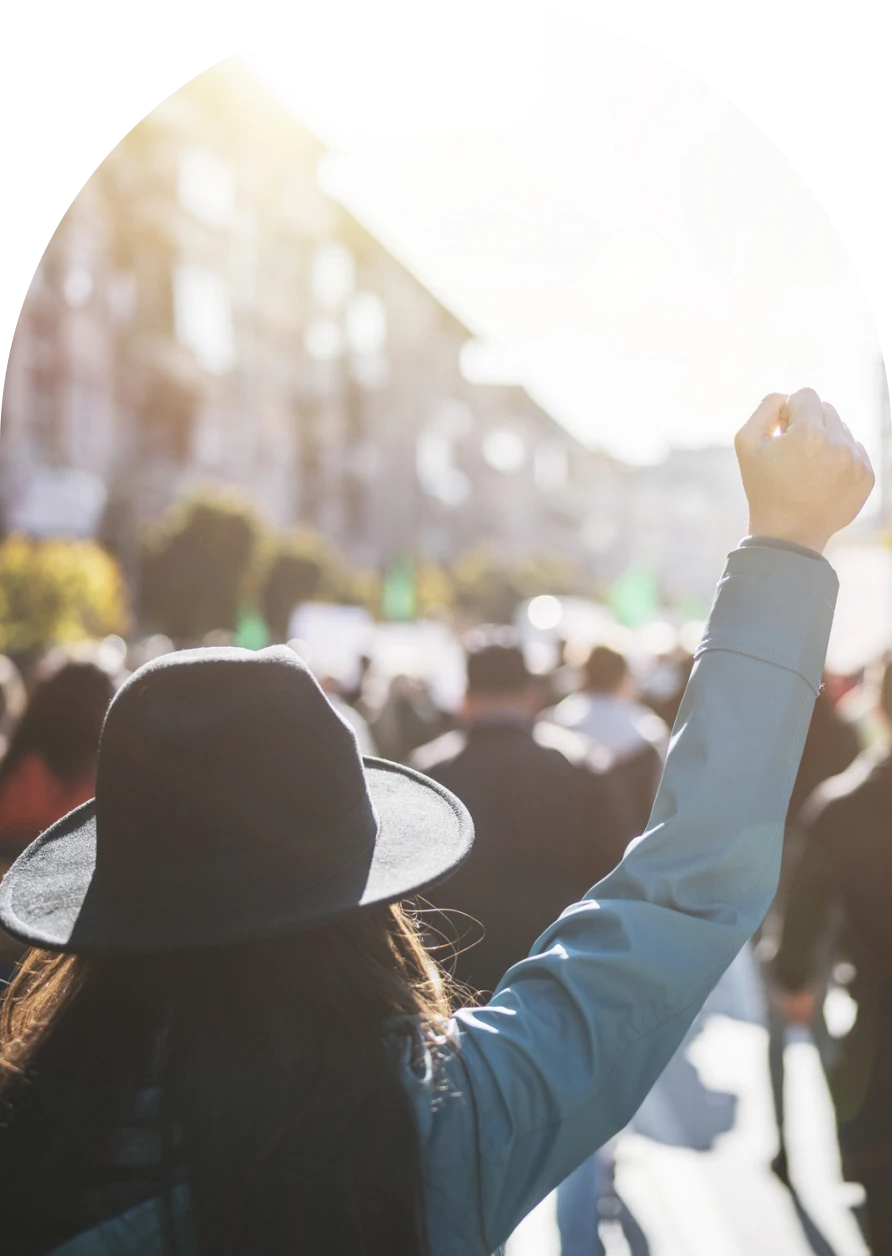 Person raising fist at a protest