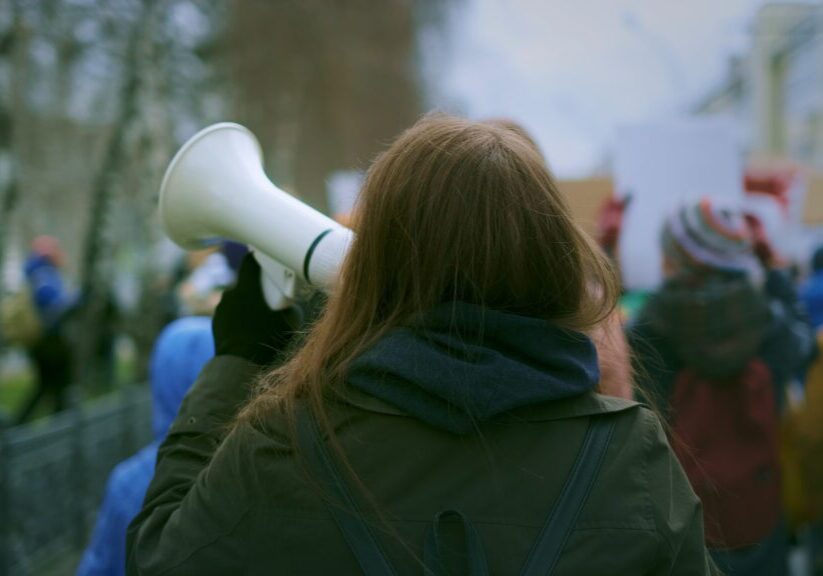 Activist speaking during outdoor protest